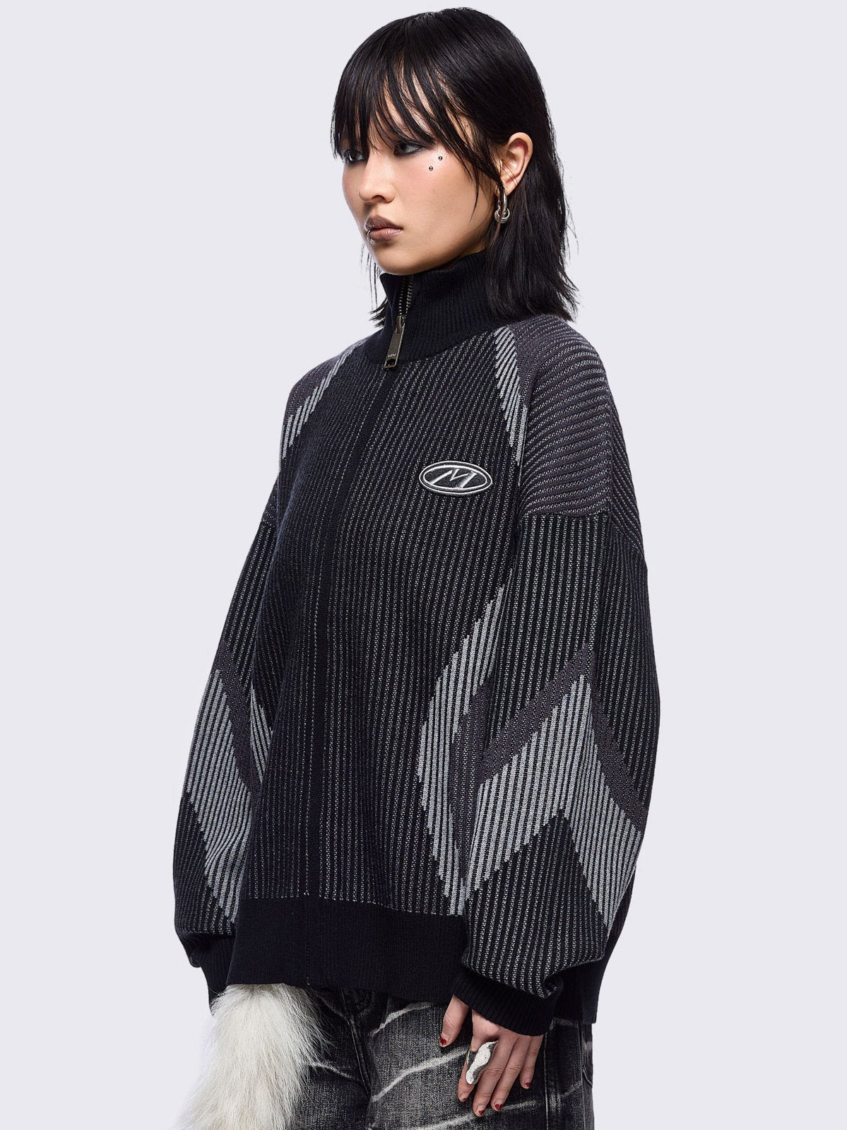 Black and grey color block knitted zip-up cardigan.