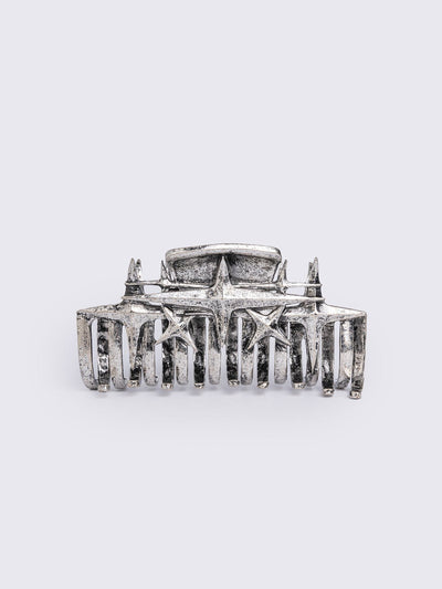 Metal hair claw clip with stars design.