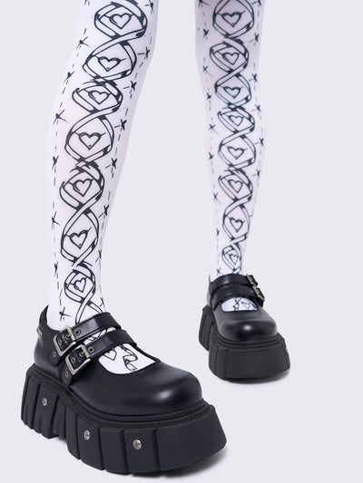Opaque tights in white with black lace-up corset print.