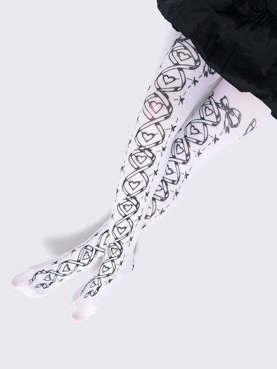 Opaque tights in white with black lace-up corset print.