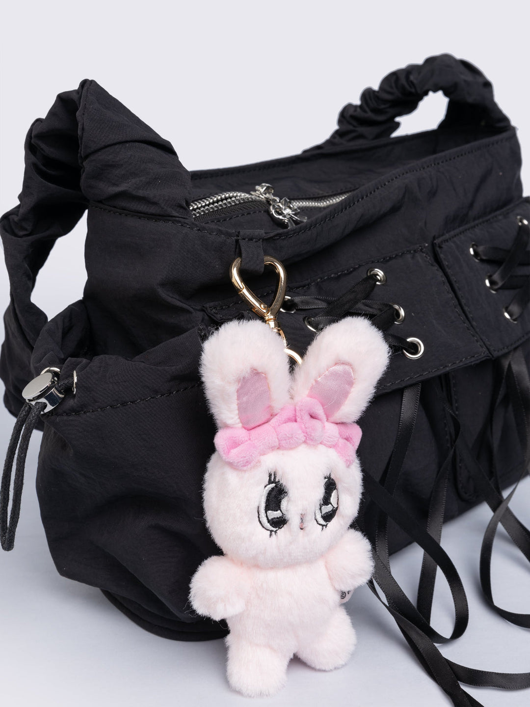 Minga London MINGA X EMA GASPAR バニーぬいぐるみバックパック Black Nylon Handbag with Pink Plush Bunny Keychain | Minga