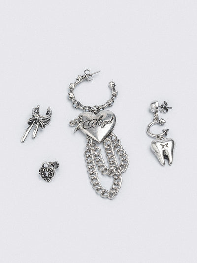 Silver 4pc layering earring set featuring heart and tooth pendant in chunky hoops, studs and ear cuff style.