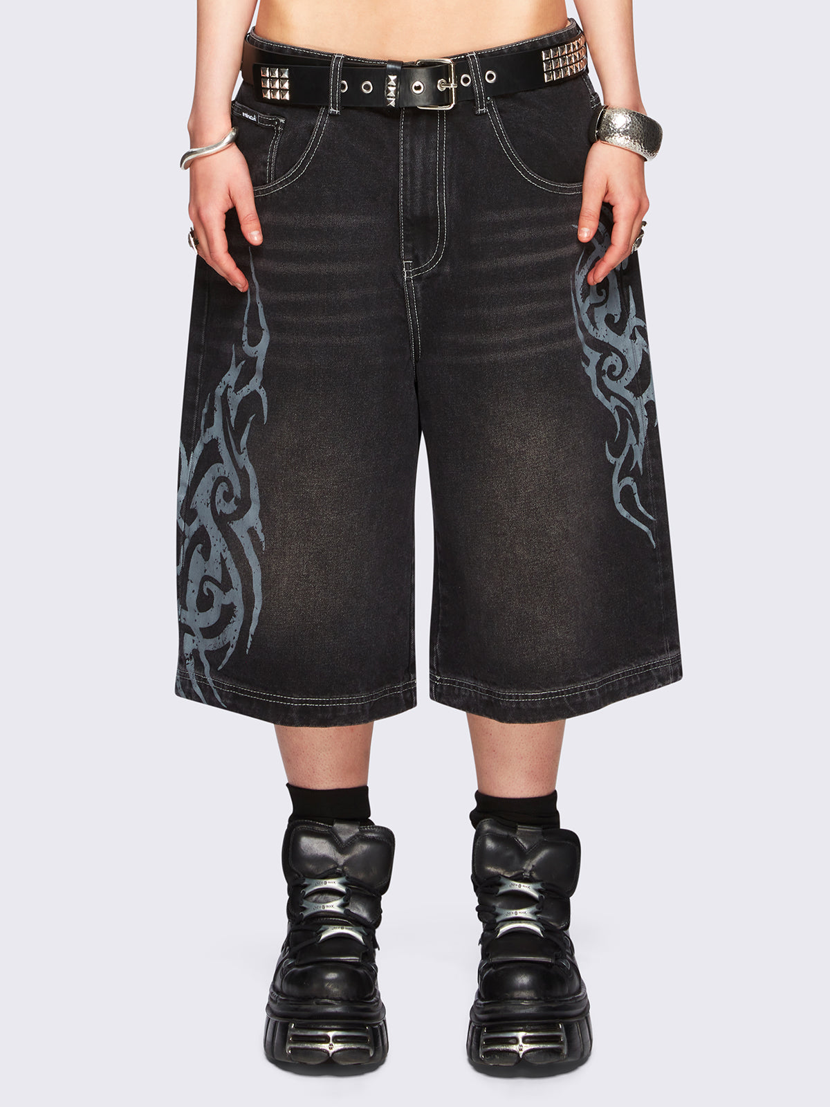 Black washed longline denim jorts with grey sigilism tattoo prints on side and back.