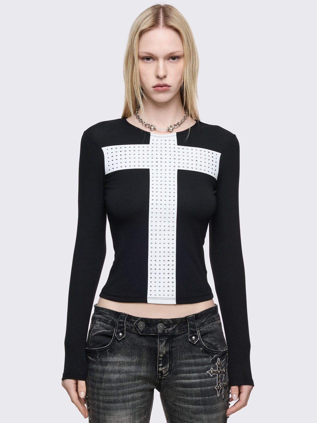 Black long sleeve top with white chunky cross with silver studs