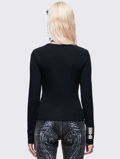 Black long sleeve top with white chunky cross with silver studs