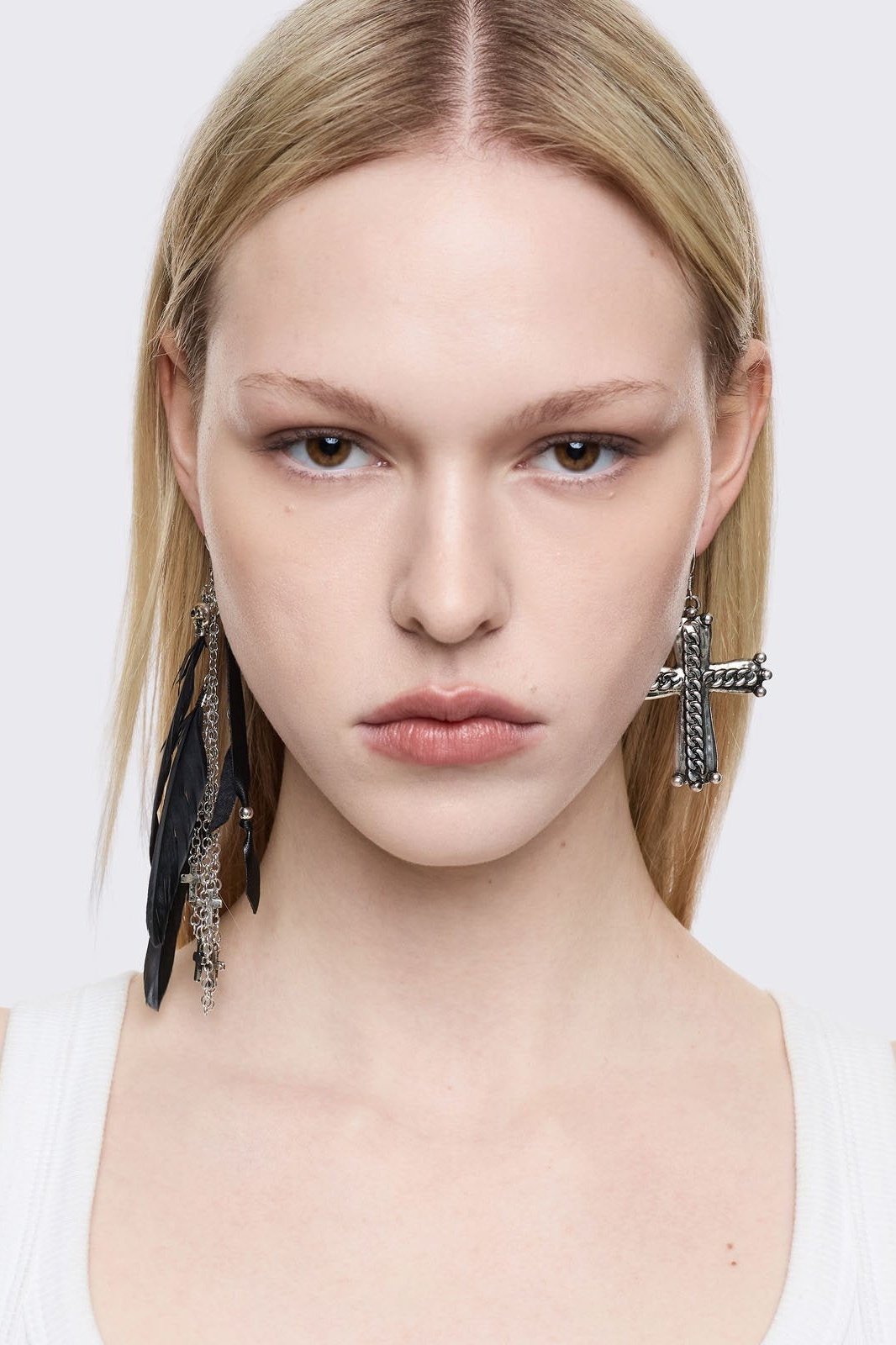 Silver 5pc earring set with black feathers, cross and gem pendants.