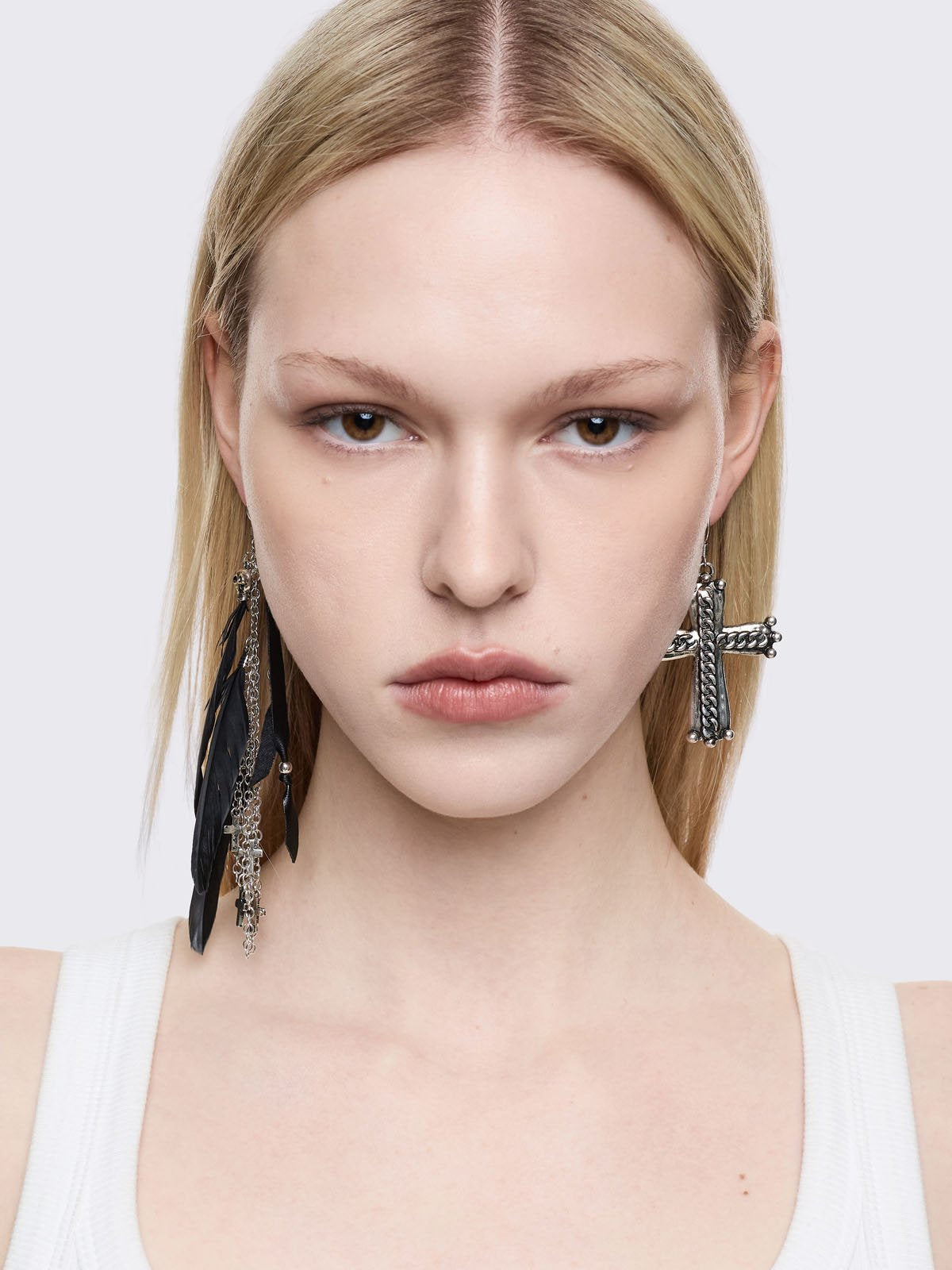 Silver 5pc earring set with black feathers, cross and gem pendants.