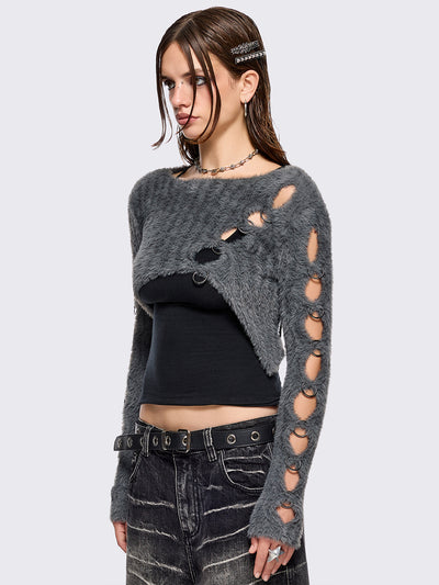 Grey fuzzy knitted sweater with cut-outs with metal ring hardware details.
Bolero asymmetric style.