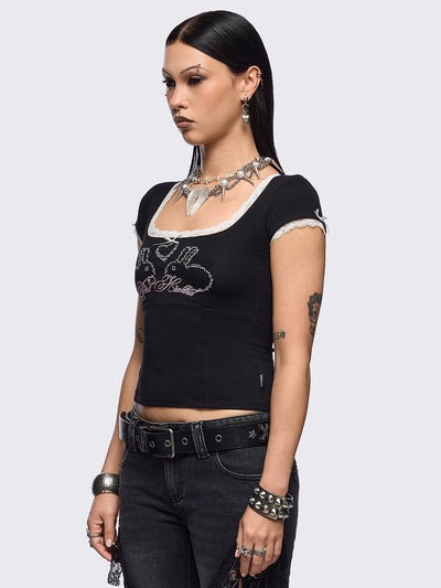 Black baby tee with "Doll Hearted" and bunnies graphic embroidery, white lace at seams and bow details.