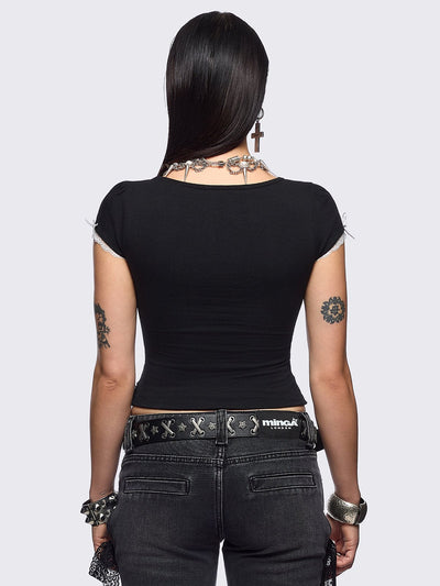 Black baby tee with "Doll Hearted" and bunnies graphic embroidery, white lace at seams and bow details.