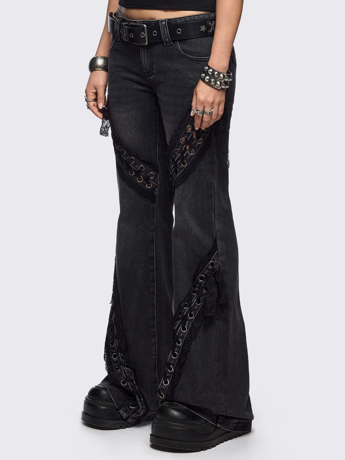 Black washed flare jeans with lace up bow details.