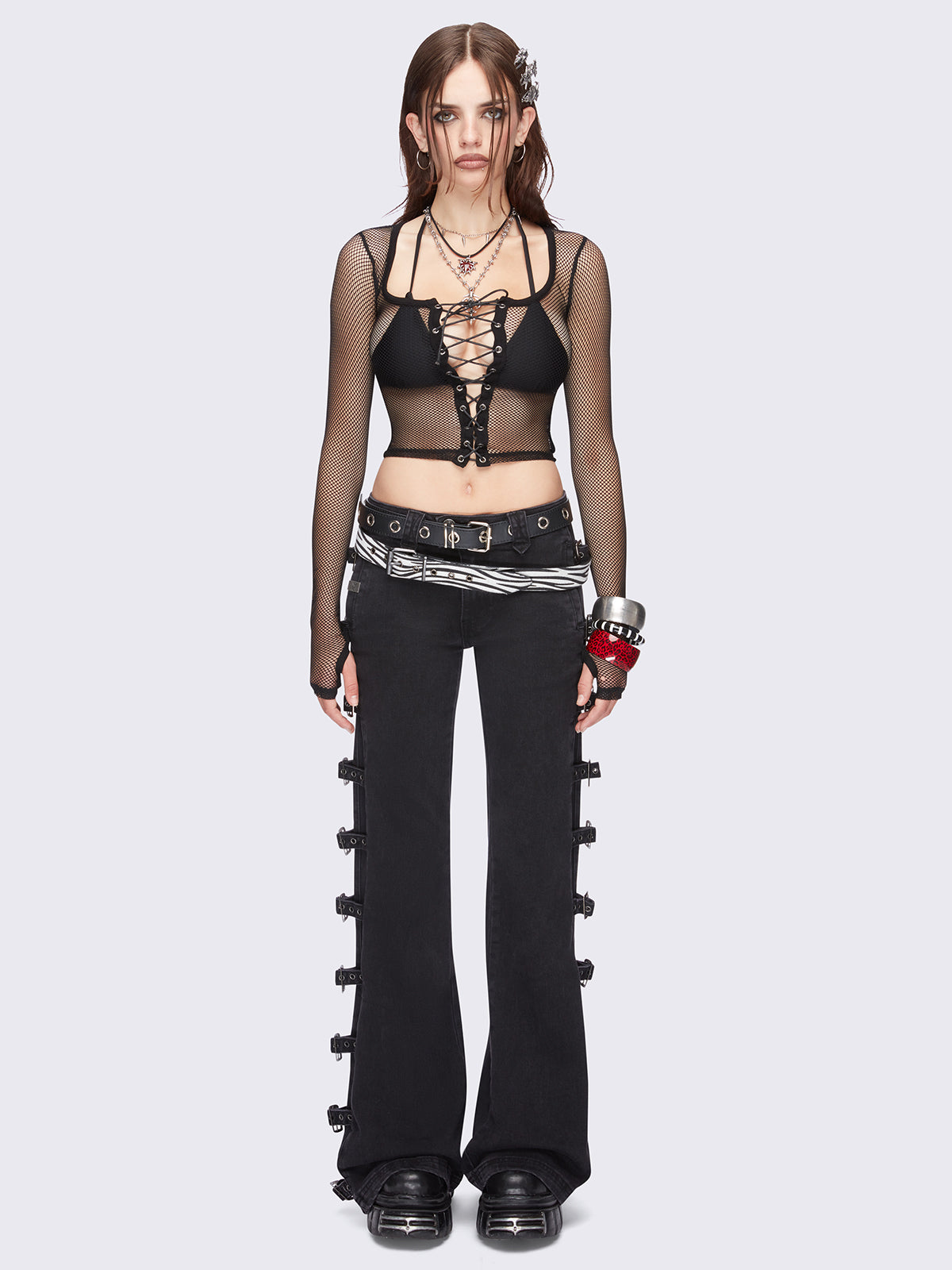 Black flared jeans with buckle details on side and low waist.