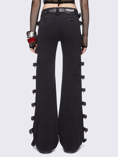 Black flared jeans with buckle details on side and low waist.