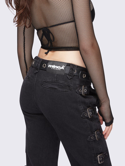 Black flared jeans with buckle details on side and low waist.