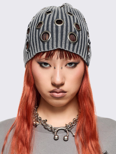 Grey ribbed knit beanie with chunky silver eyelets.