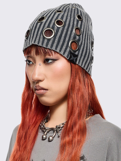 Grey ribbed knit beanie with chunky silver eyelets.
