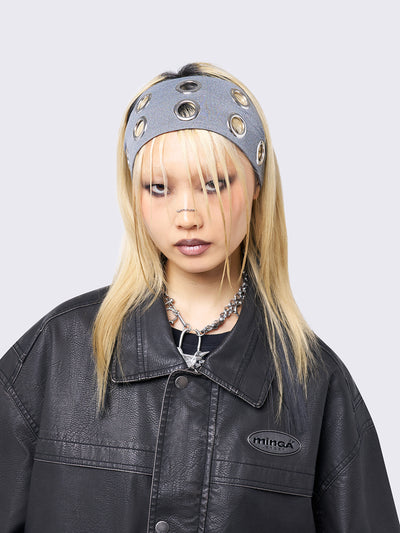 Grey headband with metallic hole details.