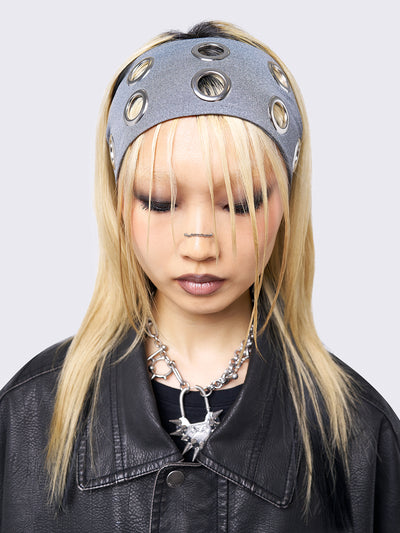 Grey headband with metallic hole details.