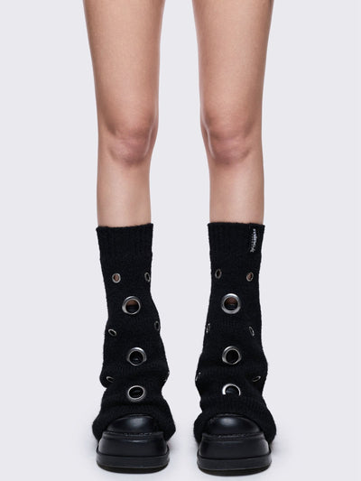 Black knitted flare leg warmers with chunky silver eyelets