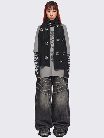 Black knitted scarf with chunky silver eyelets.