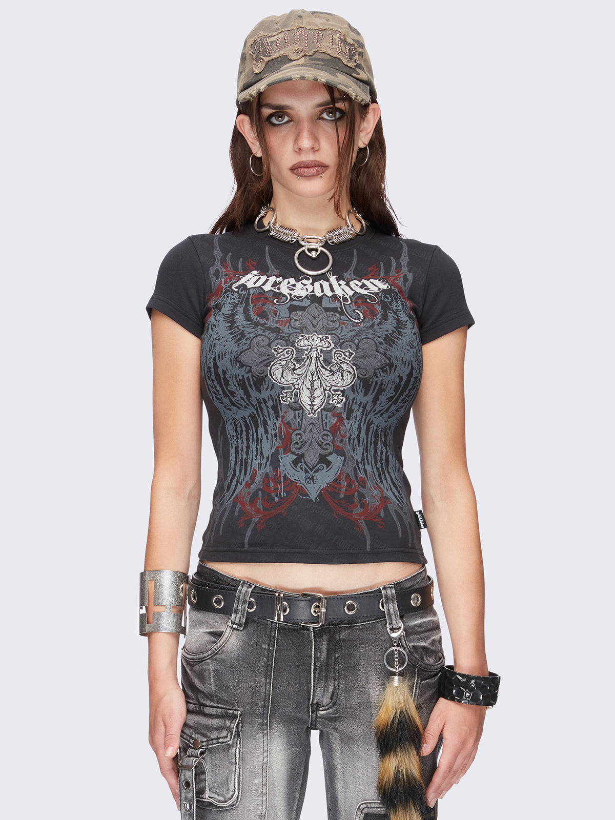 Black graphic baby tee with "Foresaken" and winged cross graphic print.