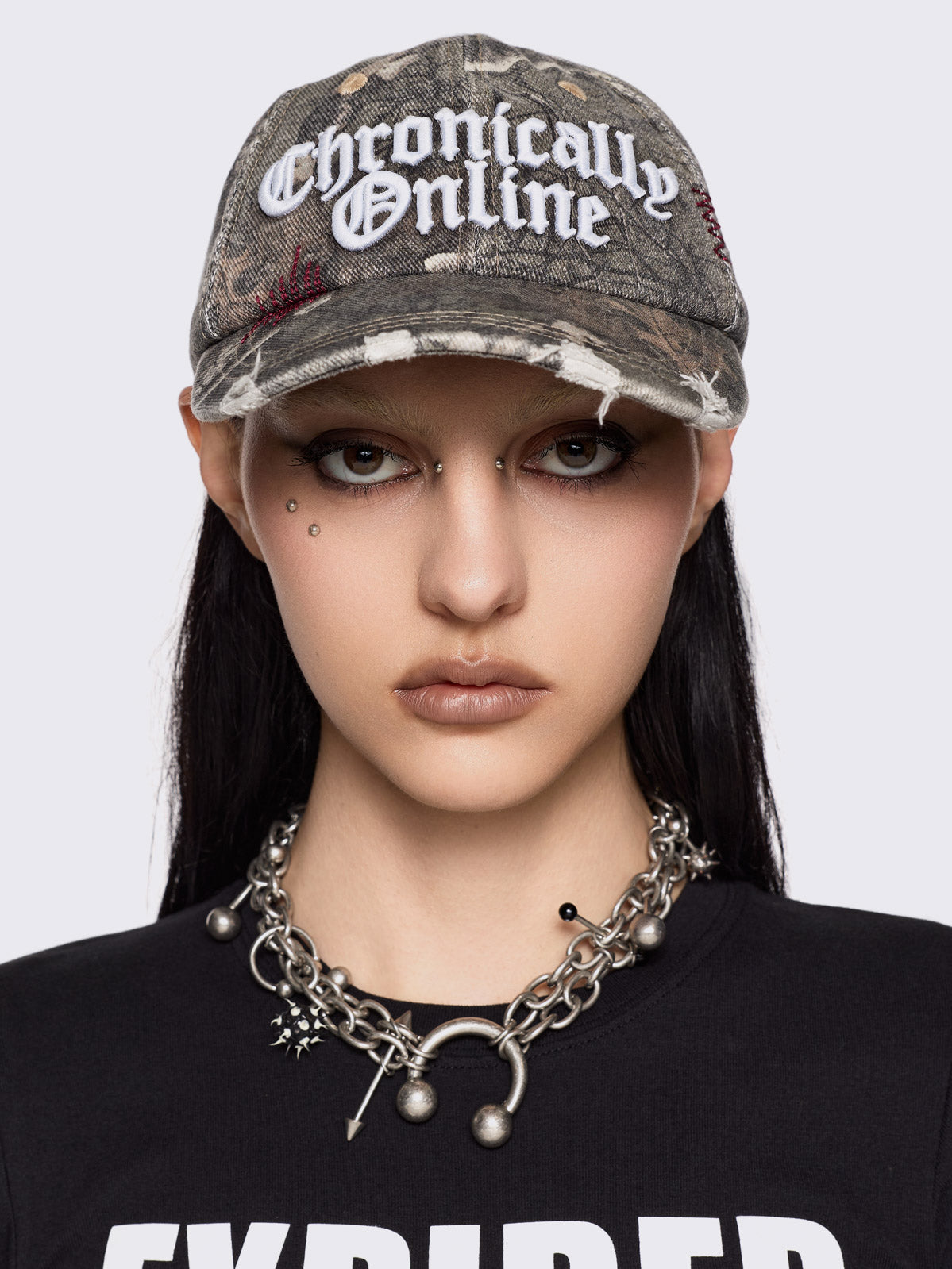 Forest tree como print denim baseball cap with "Chronically online" chunky embroidery and distressed details.