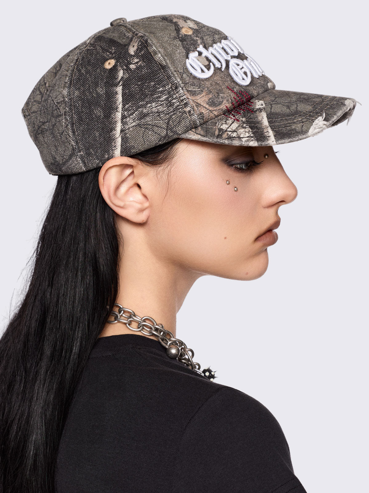 Forest tree como print denim baseball cap with "Chronically online" chunky embroidery and distressed details.