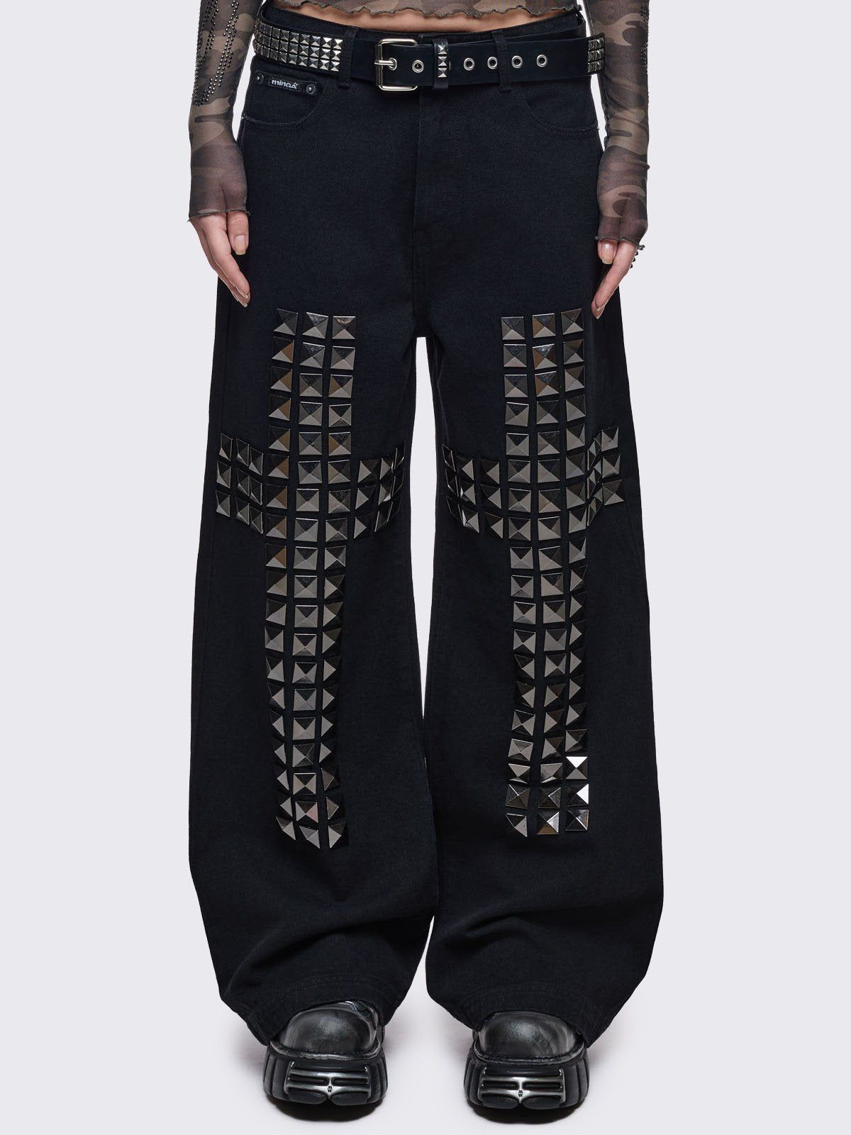 Black baggy jeans with silver studded crosses.
