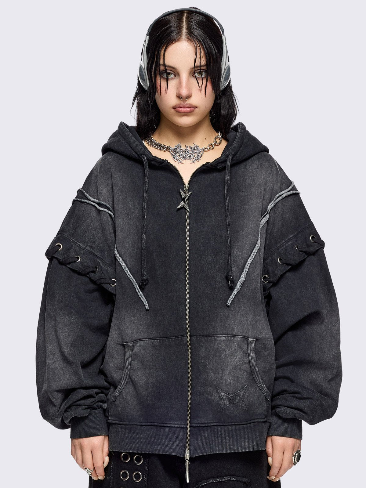 Black washed zip up hoodie. Featuring a layered effect, with selver eyelets, lace ups and seams details. 