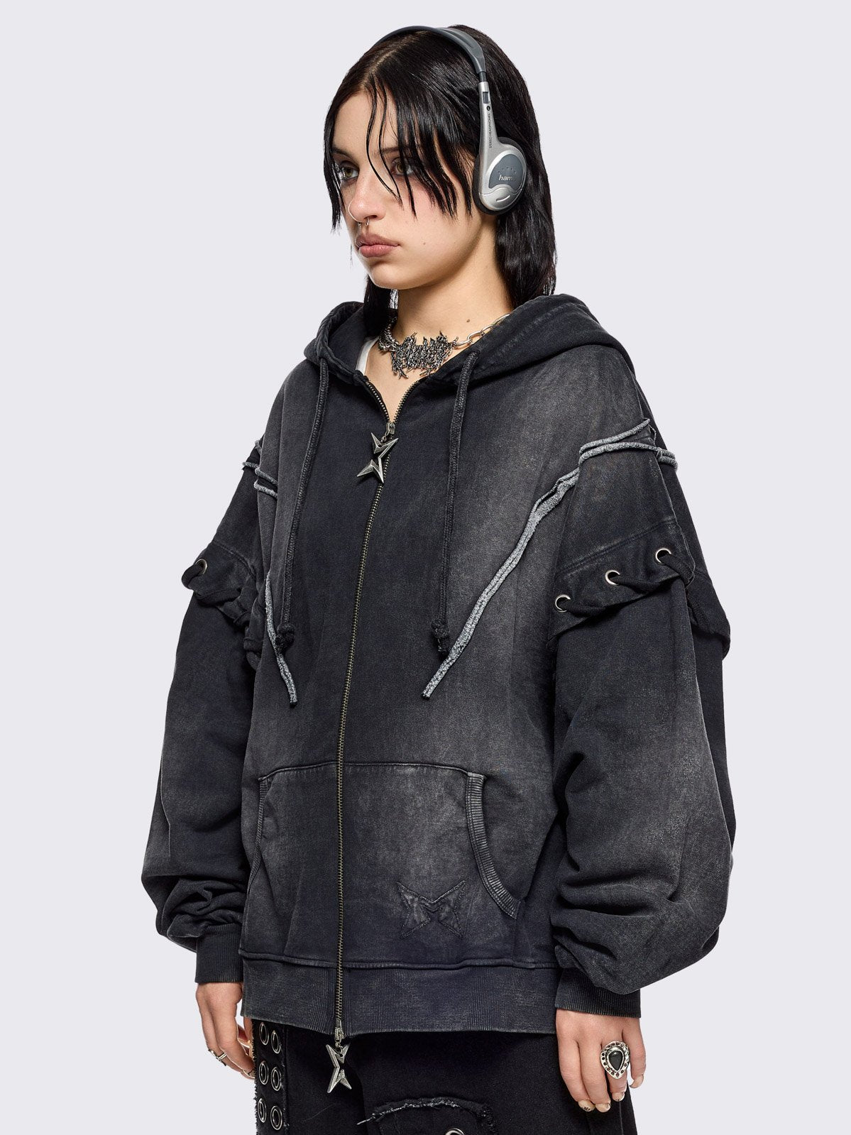 Black washed zip up hoodie. Featuring a layered effect, with selver eyelets, lace ups and seams details. 