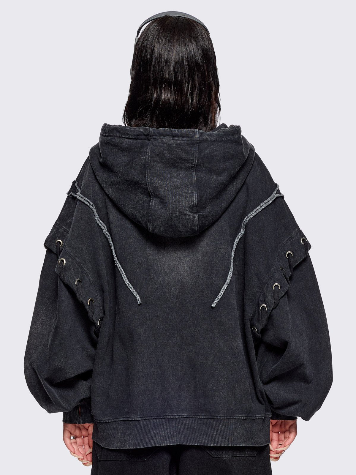 Black washed zip up hoodie. Featuring a layered effect, with selver eyelets, lace ups and seams details. 