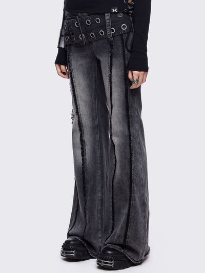 Grey flared jeans with light grey overdye featuring a chunky buckle belt and distressed seams details.