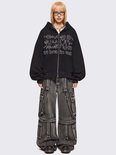 Black zip up hoodie jacket featuring a kaomoji ASCII-style embroidery in white.
