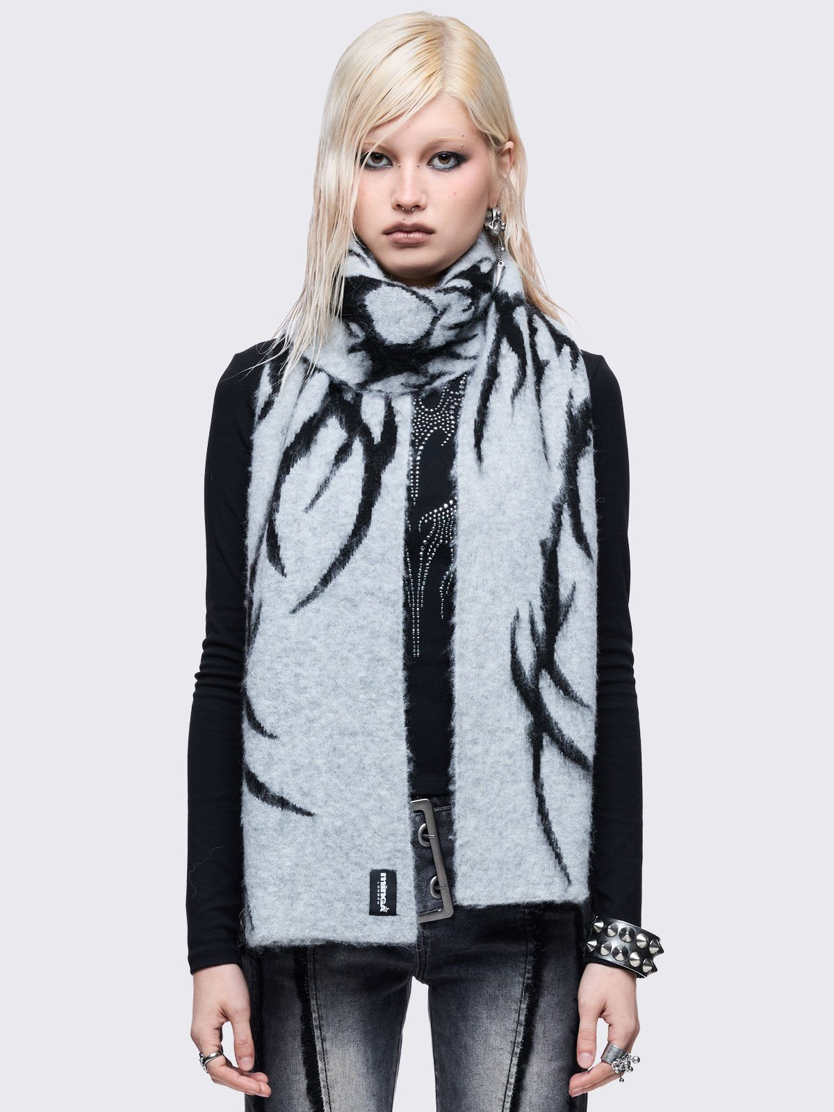 Grey and black reversible fluffy scarf with tribal sigilism design.