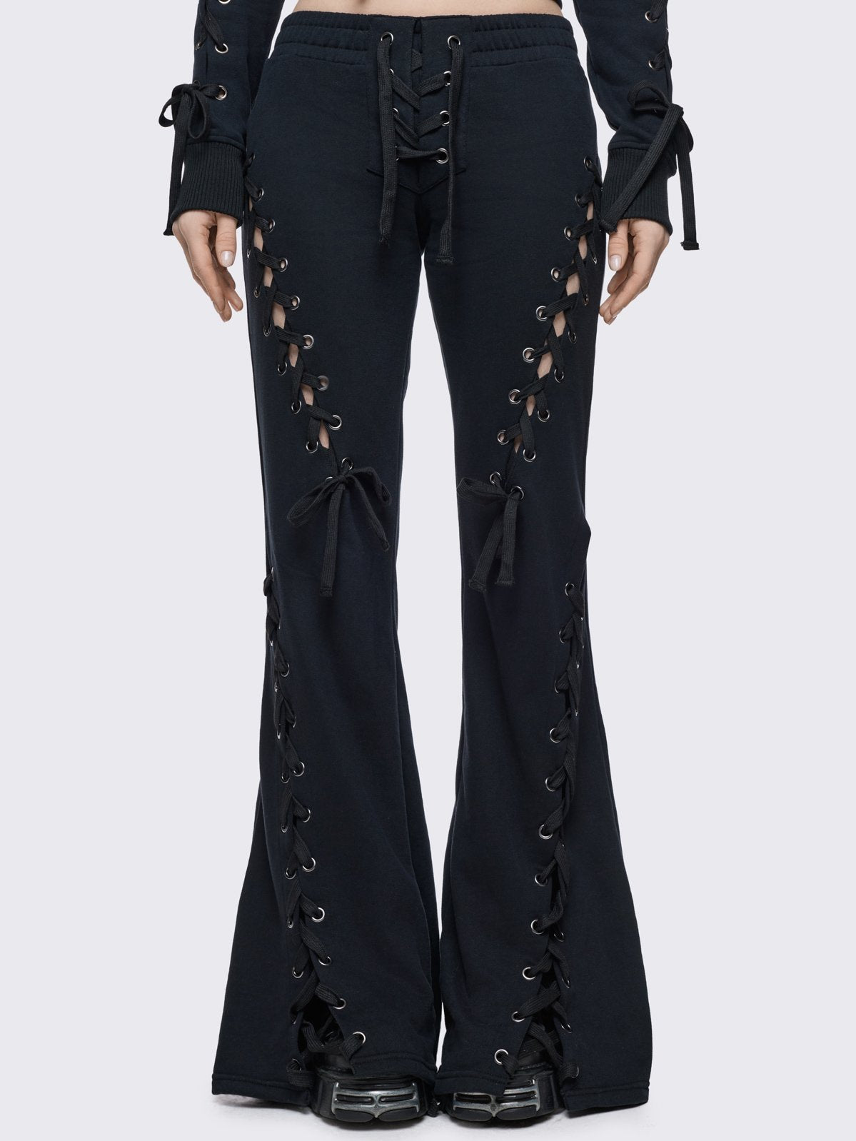 Black flared sweatpants with open lace-up corset details