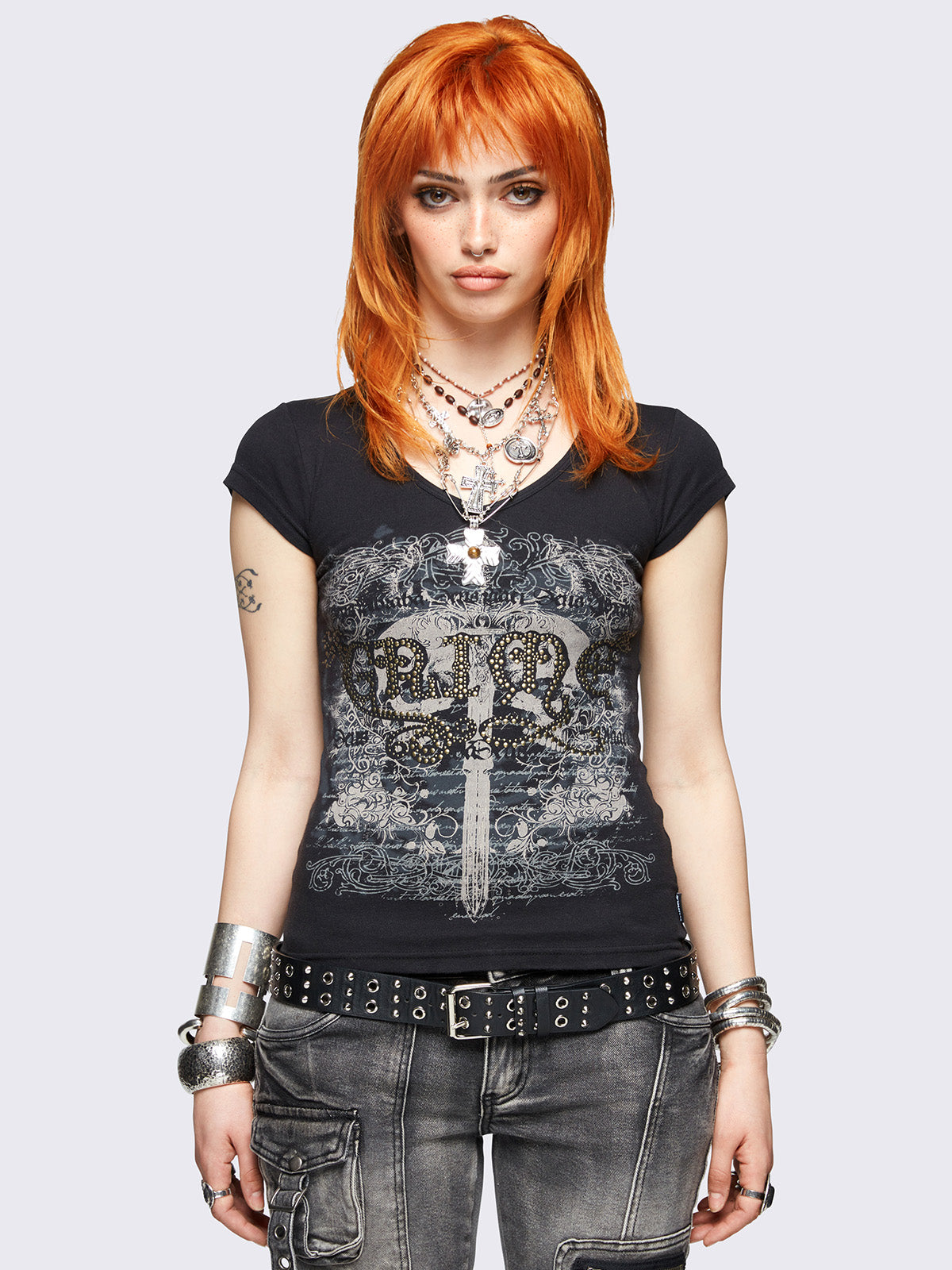 Black graphic v-neck baby tee featuring grunge graphic front print and "Grime" hot fix stud detail.