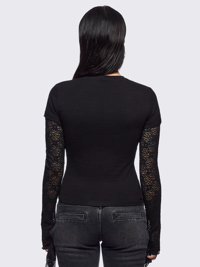 Black layered long sleeve baby tee featuring a grunge sigilism graphic front print and lace contrast sleeves with thumbhole cuffs.