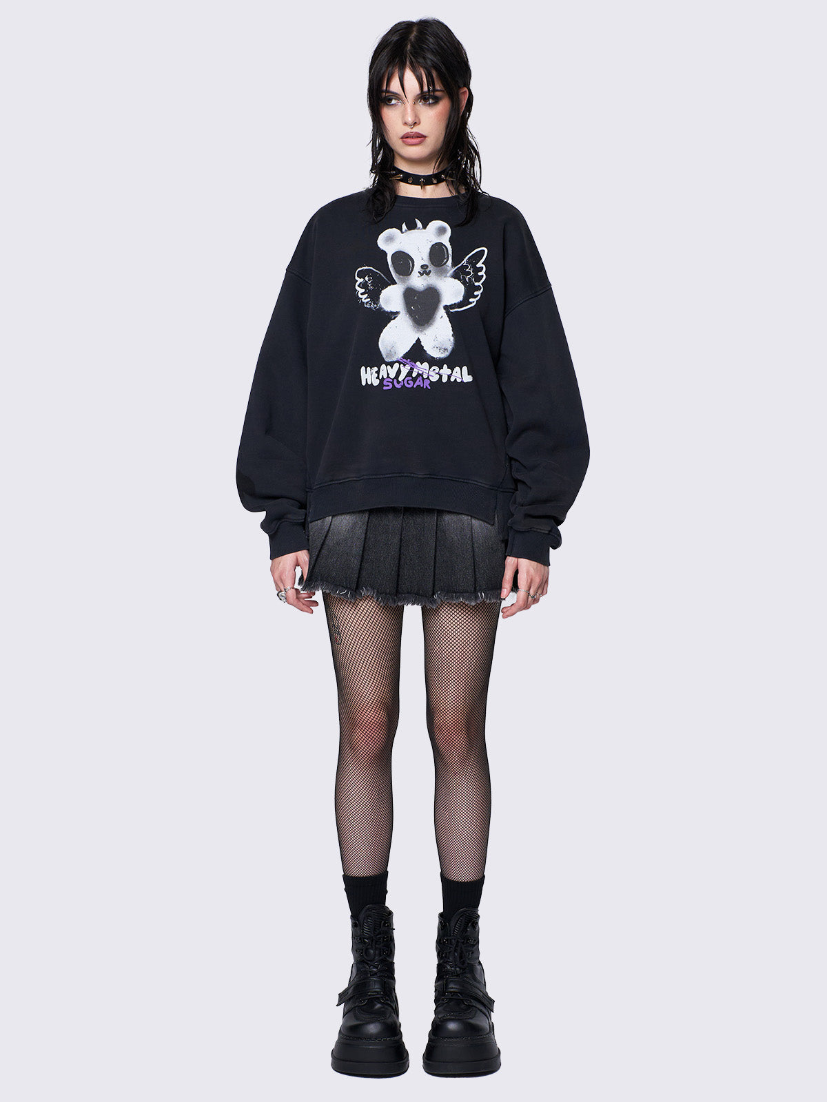 Oversized black sweatshirt with a teddy bear graphic front print by @iscreamcolour, featuring side slits and drop shoulders for a relaxed fit.