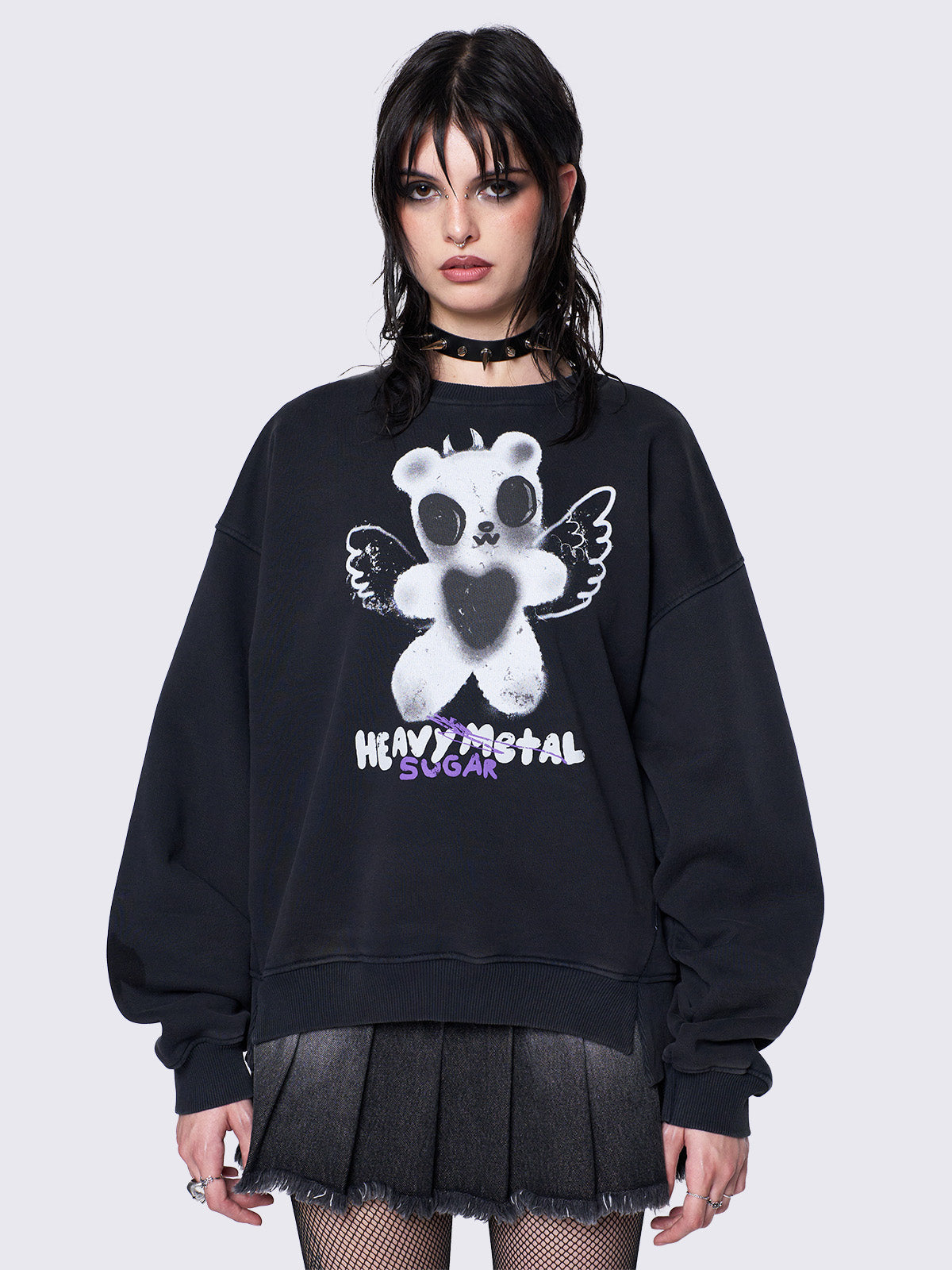 Oversized black sweatshirt with a teddy bear graphic front print by @iscreamcolour, featuring side slits and drop shoulders for a relaxed fit.