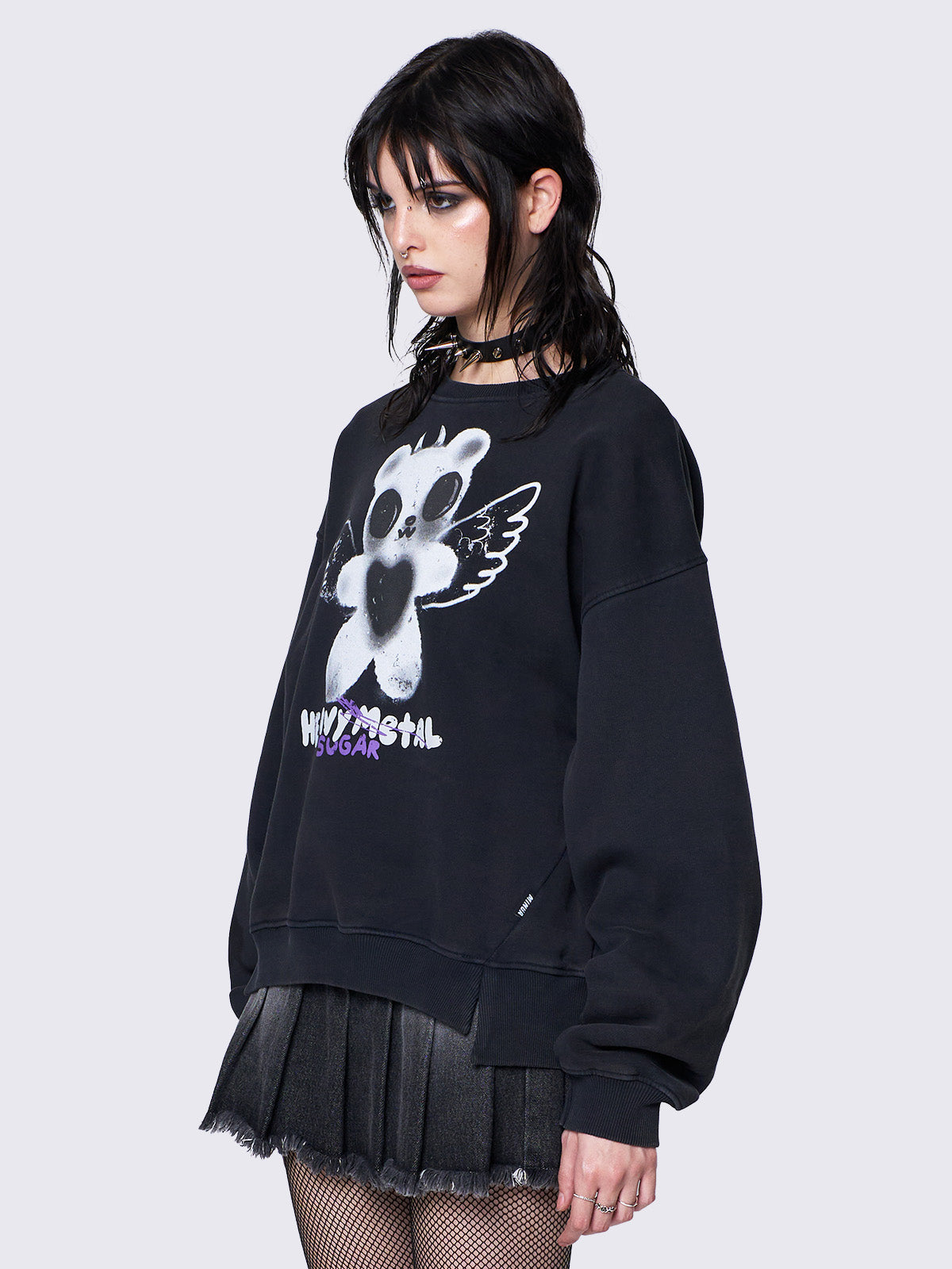 Oversized black sweatshirt with a teddy bear graphic front print by @iscreamcolour, featuring side slits and drop shoulders for a relaxed fit.