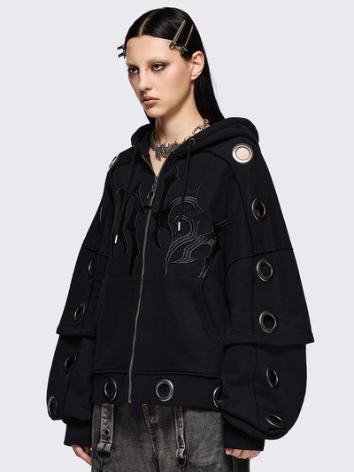 Black layered zip up hoodie, with chunky silver eyelets, raw edge seam details and Minga embroidery.