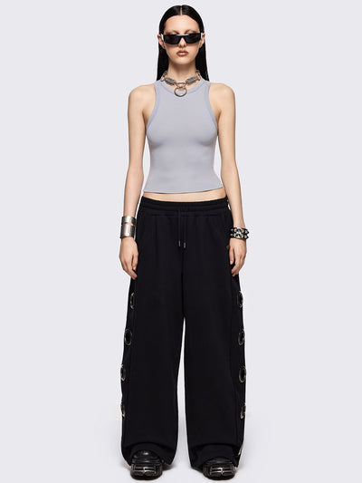 Black wide leg sweatpants with chunky silver eyelets.