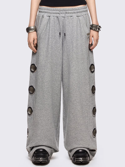 Grey marl wide leg sweatpants with chunky silver eyelets.