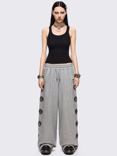 Grey marl wide leg sweatpants with chunky silver eyelets.