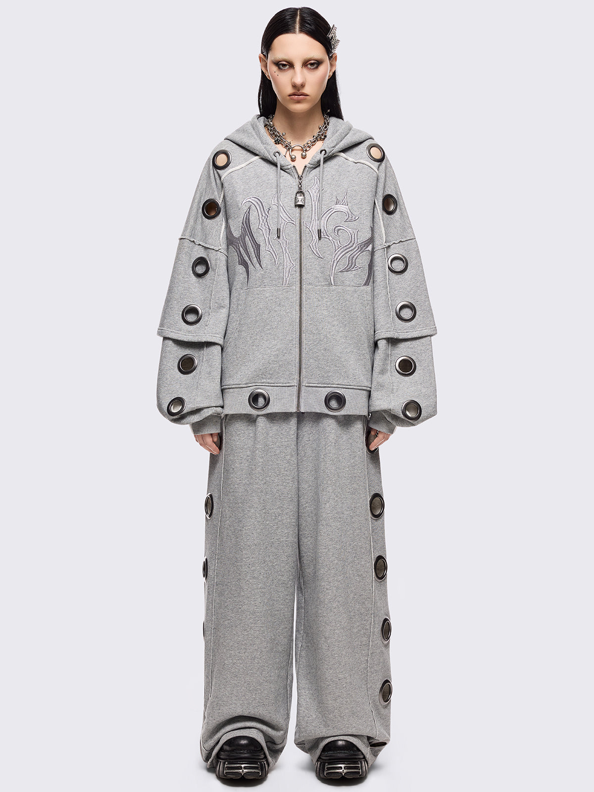 Grey marl layered zip up hoodie featuring chunky silver eyelets and raw edge seam details.