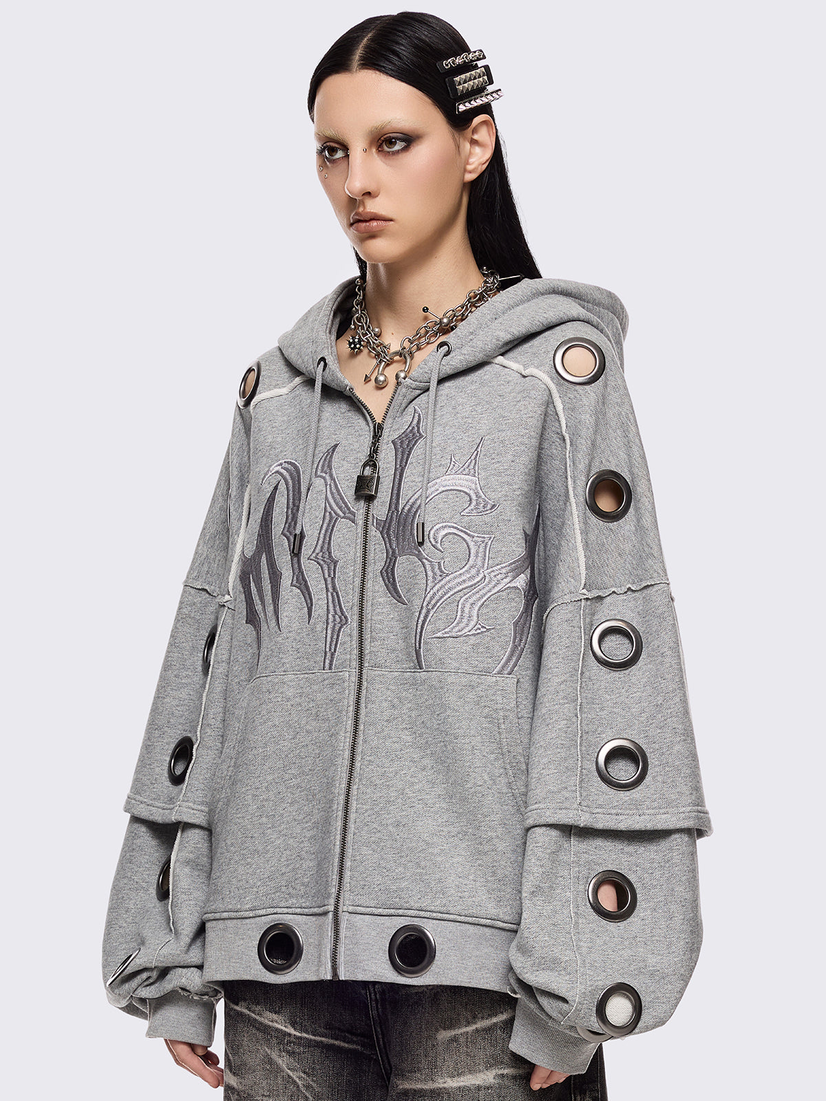 Grey marl layered zip up hoodie featuring chunky silver eyelets and raw edge seam details.