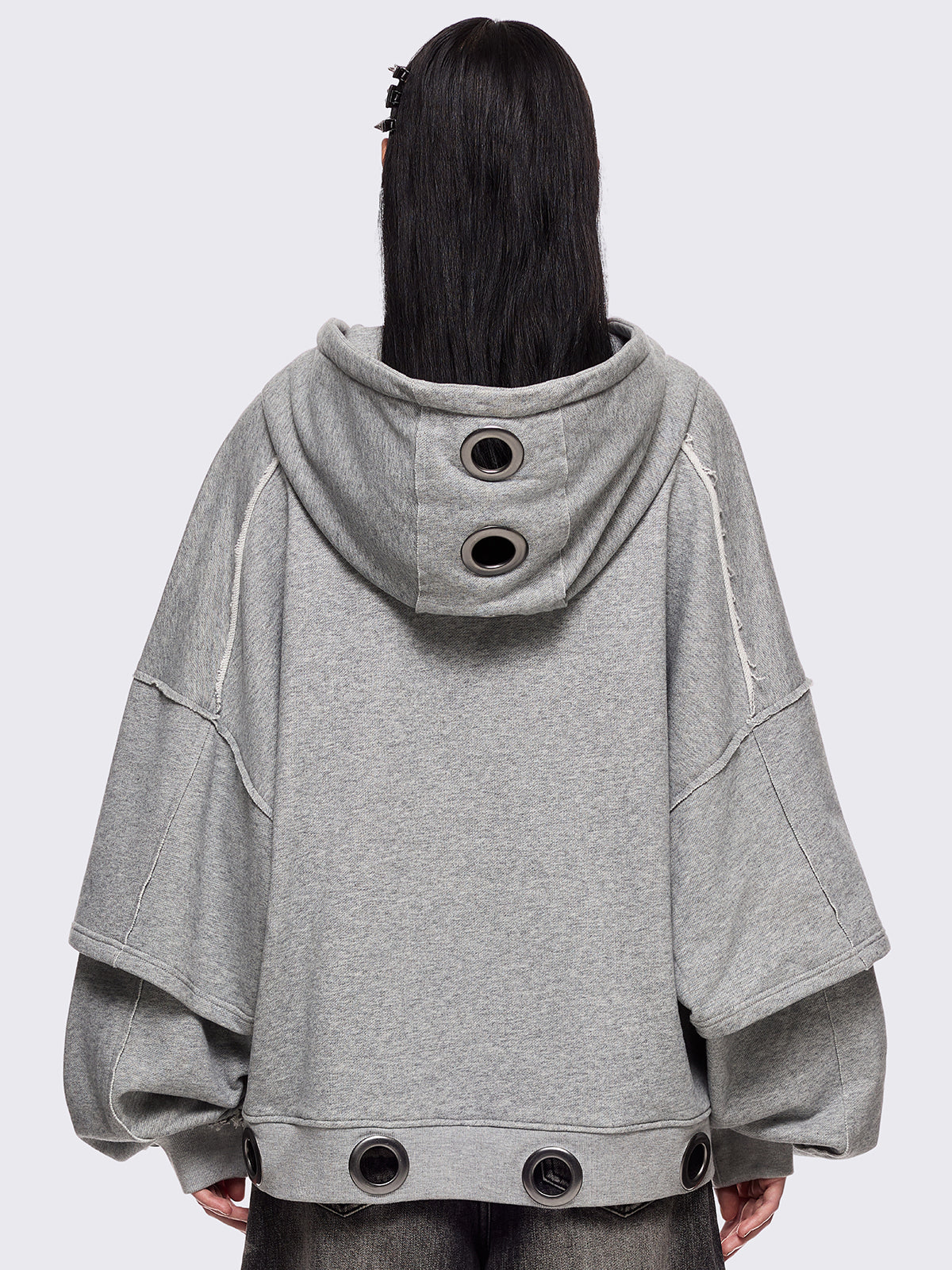 Grey marl layered zip up hoodie featuring chunky silver eyelets and raw edge seam details.