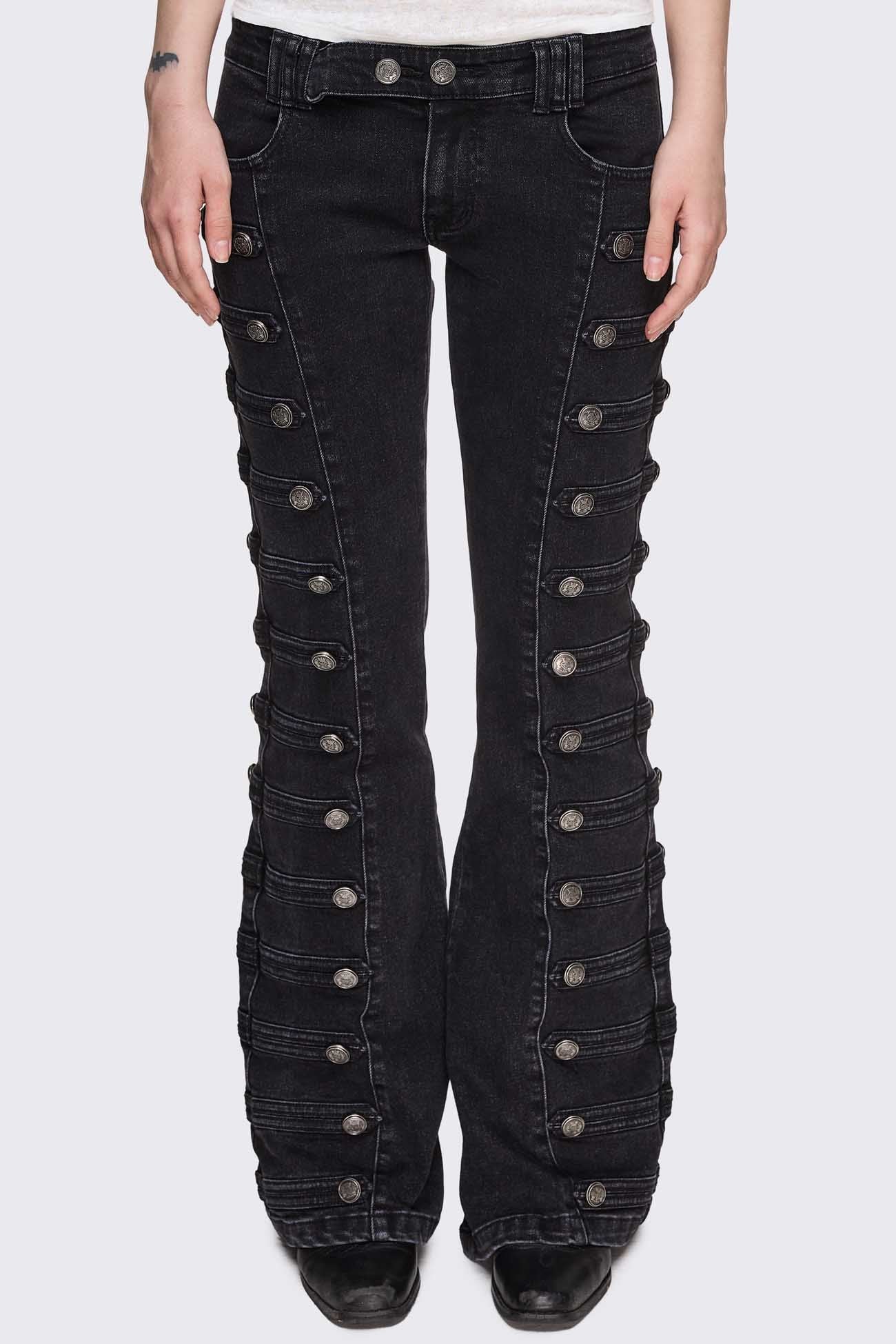 Black washed denim flare jeans with drummer-style button panels and military detailing in a dark grunge vibe.
