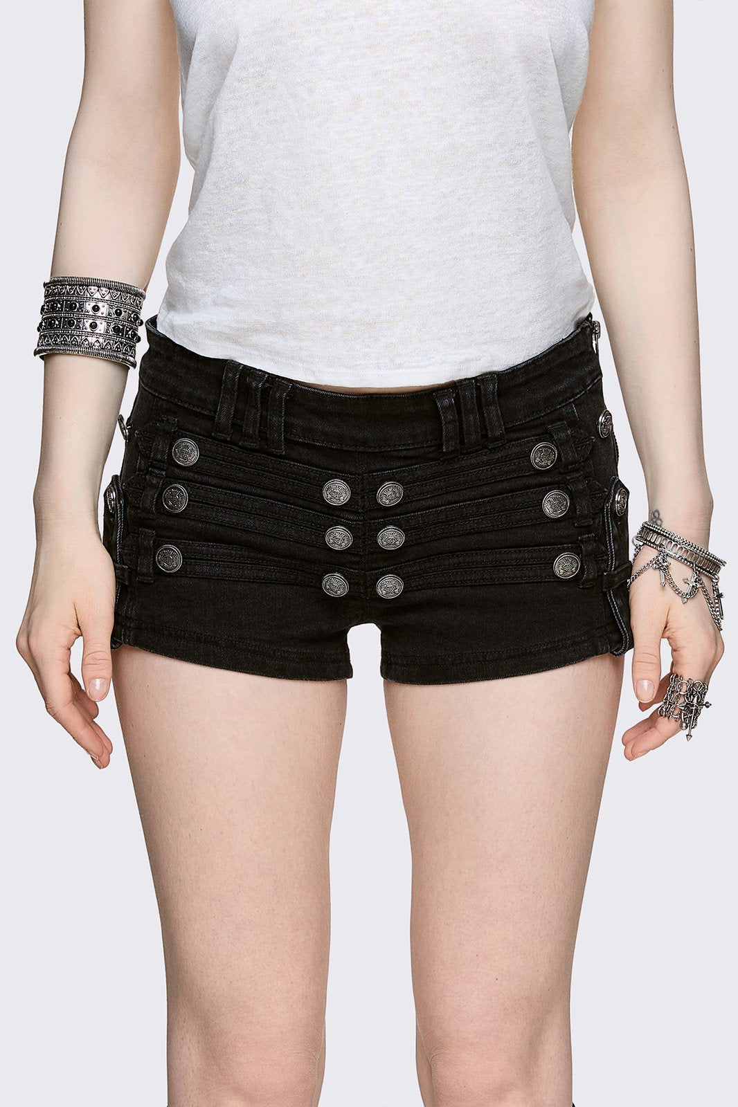 Black washed denim micro shorts with military button detailing and low-rise fit in a grunge style.