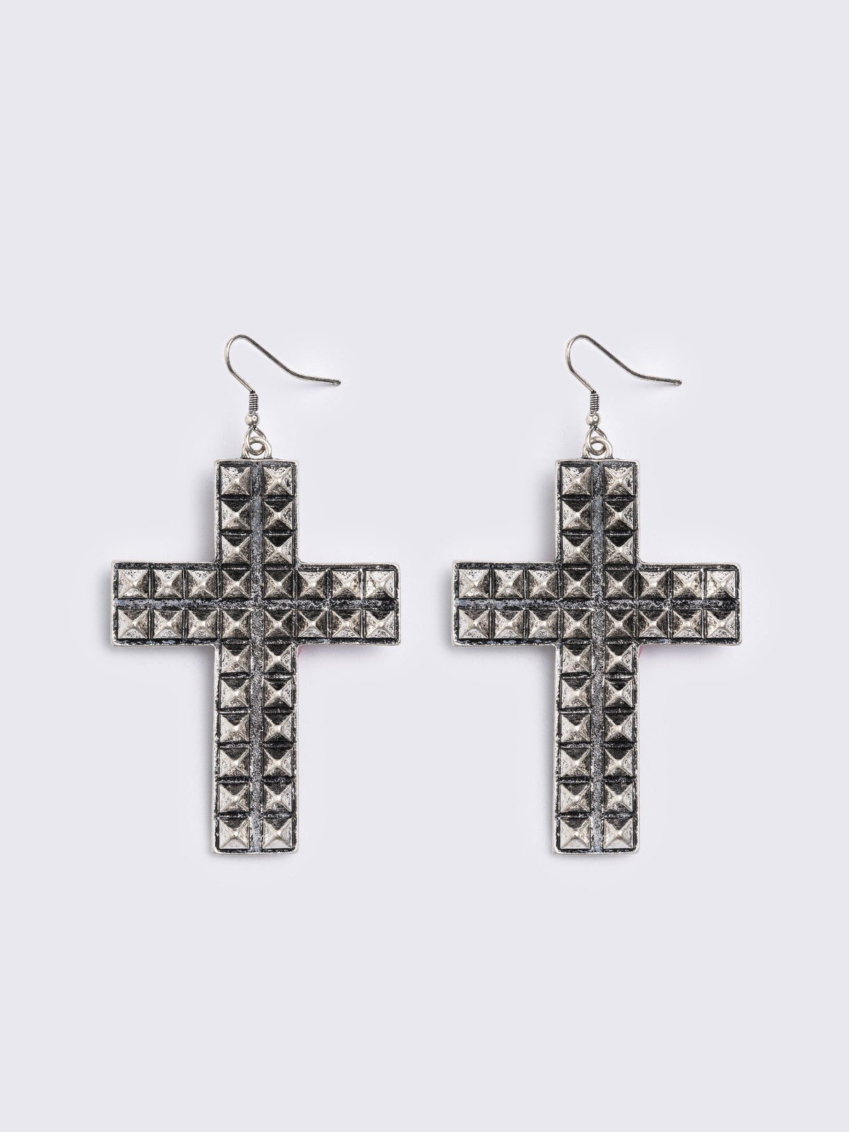 Silver dangle earrings featuring a studded cross design pendants
